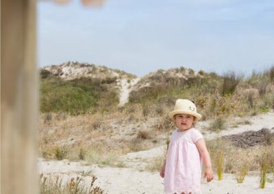 toddler girl on sand dunes