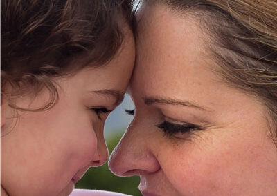 mum and daughter special moment touching foreheads