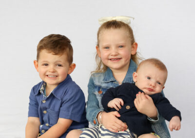 toddler and baby daycare portrait photography of three siblings