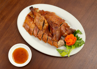 Roasted duck meal with decorative carrot and sauce. Professional Content, social media and food photography in Auckland, New Zealand.