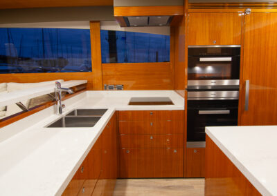 Kitchen shot of a High end Yacht photo in the marina. Professional real estate, interiors and boat photography in Whangaparaoa, Auckland, New Zealand.