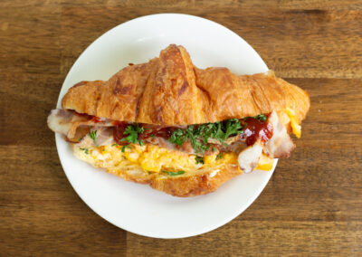 Top view of a yummy ham and egg filled croissant. Professional Content, social media and food photography in Auckland, New Zealand.