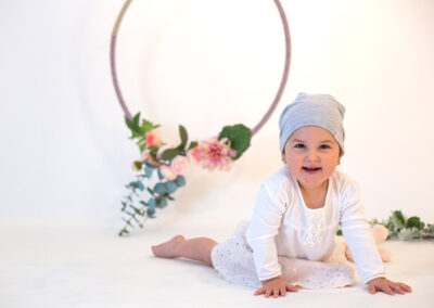 tummy time baby studio portrait with flower wreath