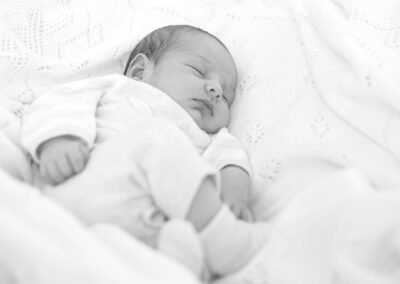 Newborn baby peacefully sleeping black and white portrait