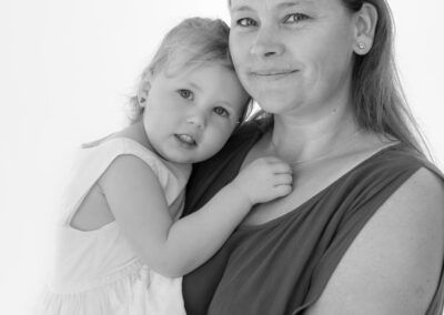 young girl hugging grandmother portrait