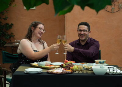 Groom and bride raising their glass