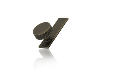 small bronze knob in studio with mirror shade
