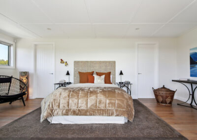 Master bedroom shot with velvet throw