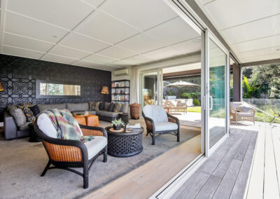 Batch Livingroom space overlooking deck with open ranchslider door