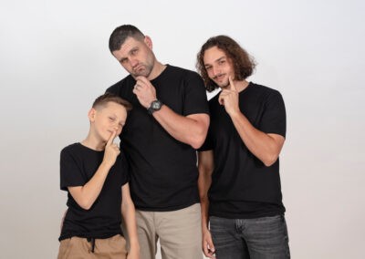 fun shot dad pulling faces with his older boys