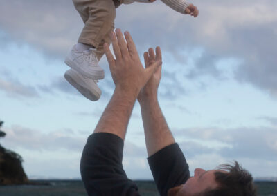 dad throwing up baby in the air