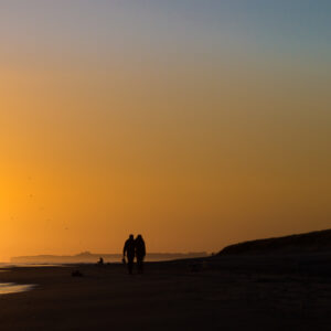 Sunset walk_ Silhouette of a couple