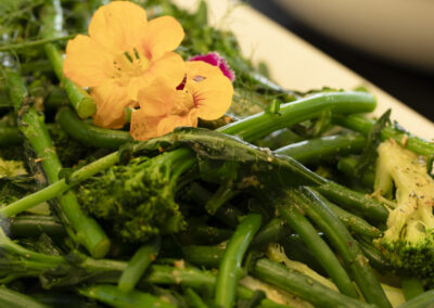 edible flower on yummy juicy green beans _professional food photography in lifestyle setting