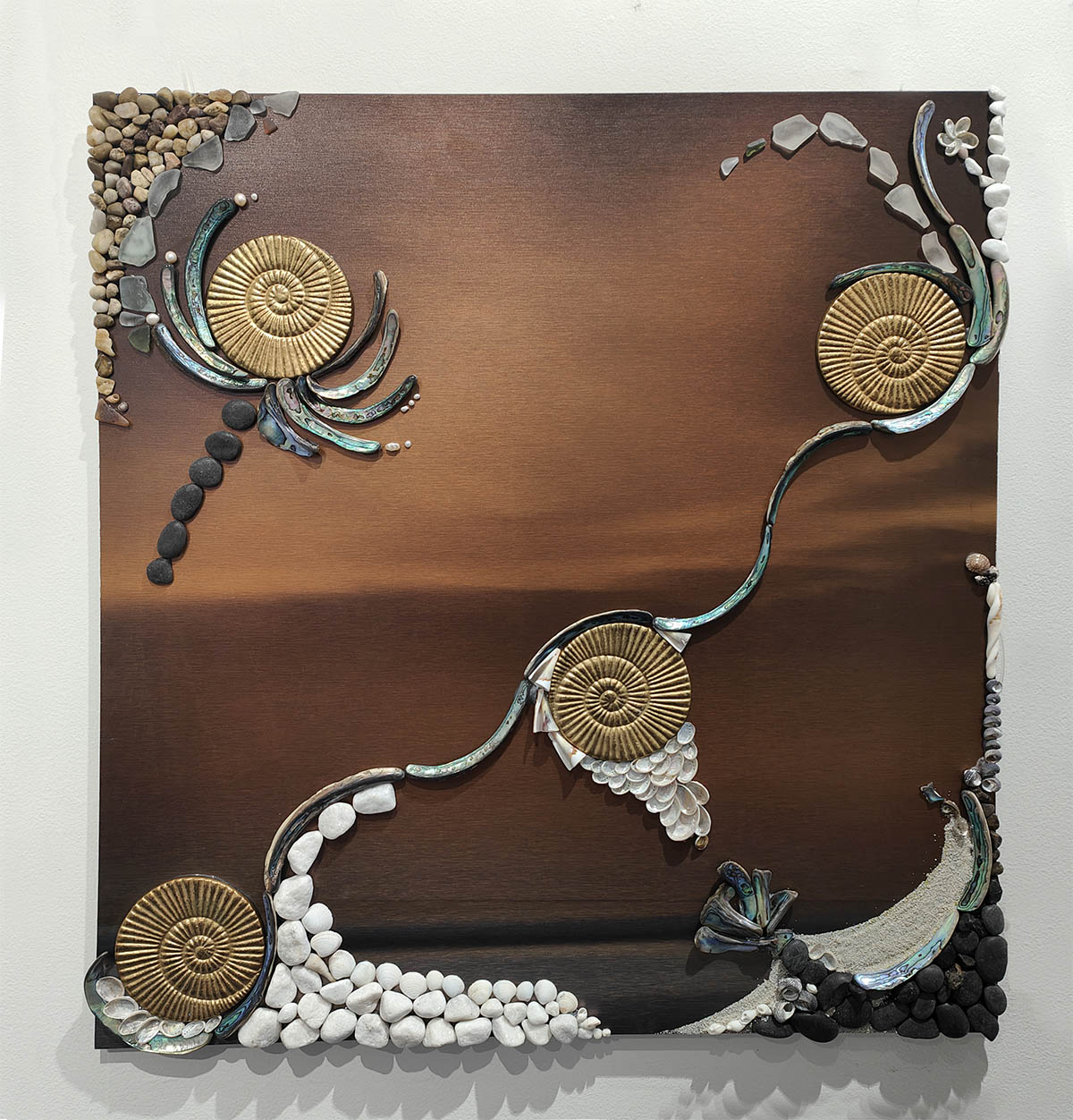 mixed media mosaic art with warm orange, bronze tones and coastal scene