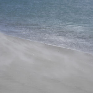 wind blowing sand on beach soft and calm